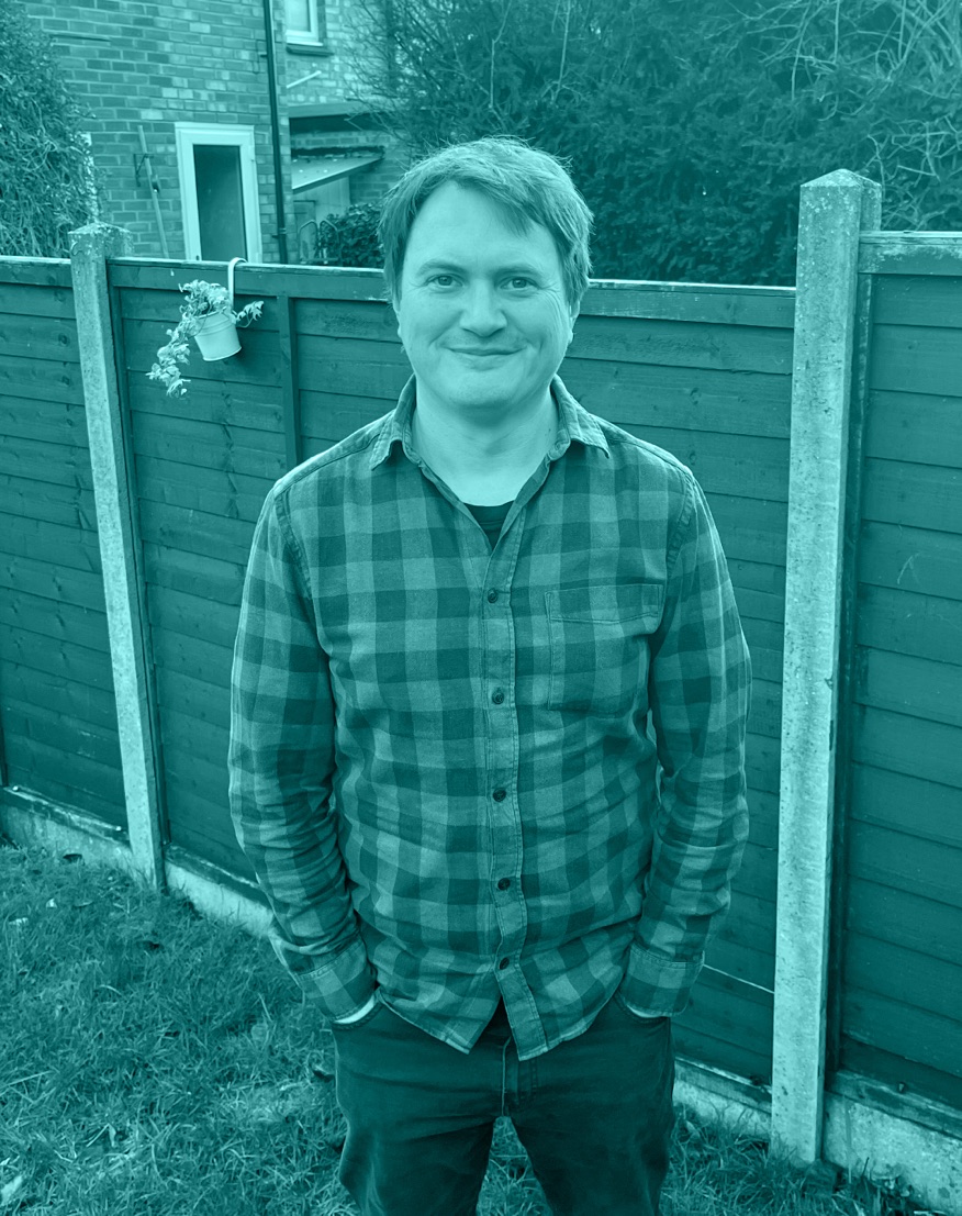 A photograph of me standing in my garden